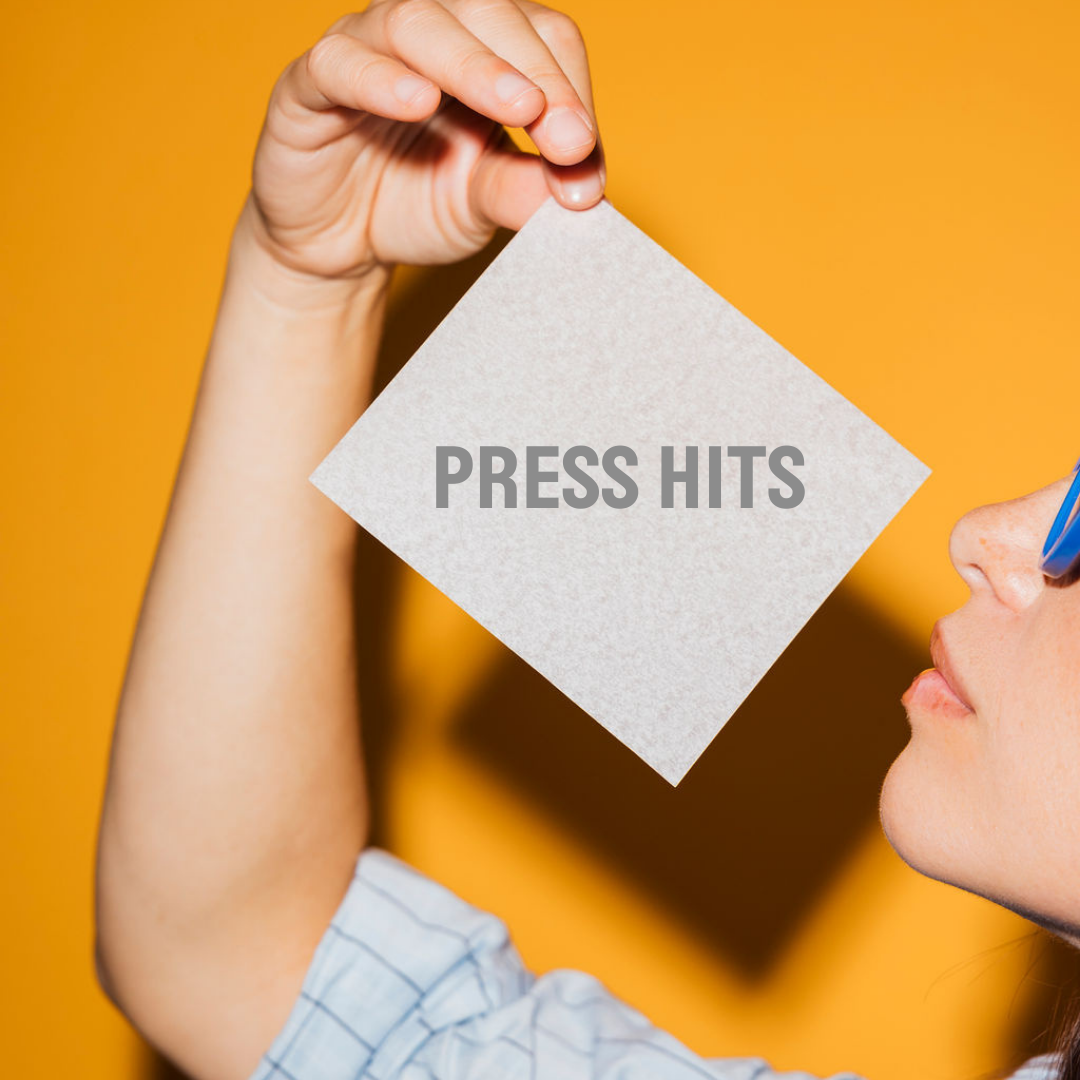women holding laundry sheet