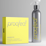 A gray bottle labeled 'PROOFED! Precision Stain Remover' next to a yellow box with 'PROOFED!' and 'FRAGRANCE-FREE EFFECTIVE CONVENIENT LAUNDRY DETERGENT SHEETS' printed on it.